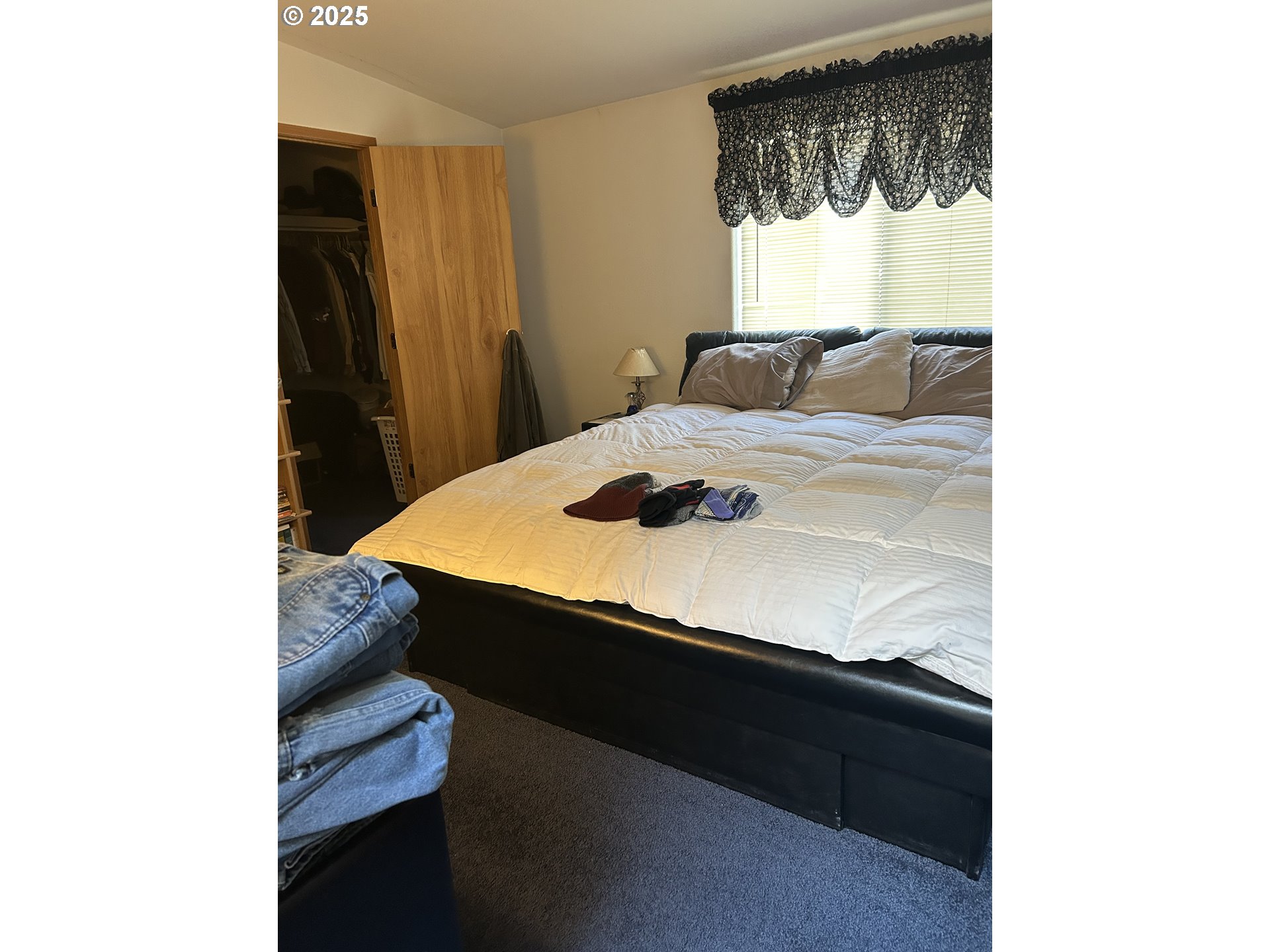 1105 Riverside Drive, Unit 17 Vernonia, OR 97064 - Photo 17 of 26 a bedroom with a bed and a window