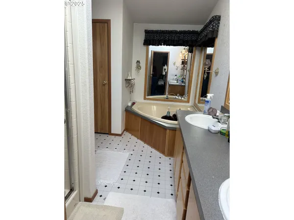 a bathroom with a glass door shower