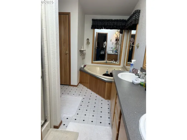 a bathroom with a glass door shower