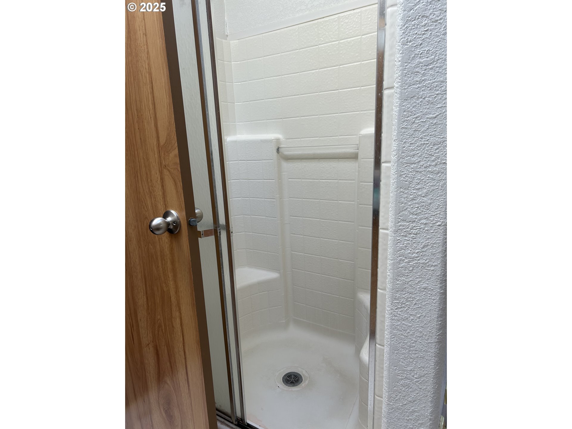 1105 Riverside Drive, Unit 17 Vernonia, OR 97064 - Photo 20 of 26 a bathroom with a glass door shower