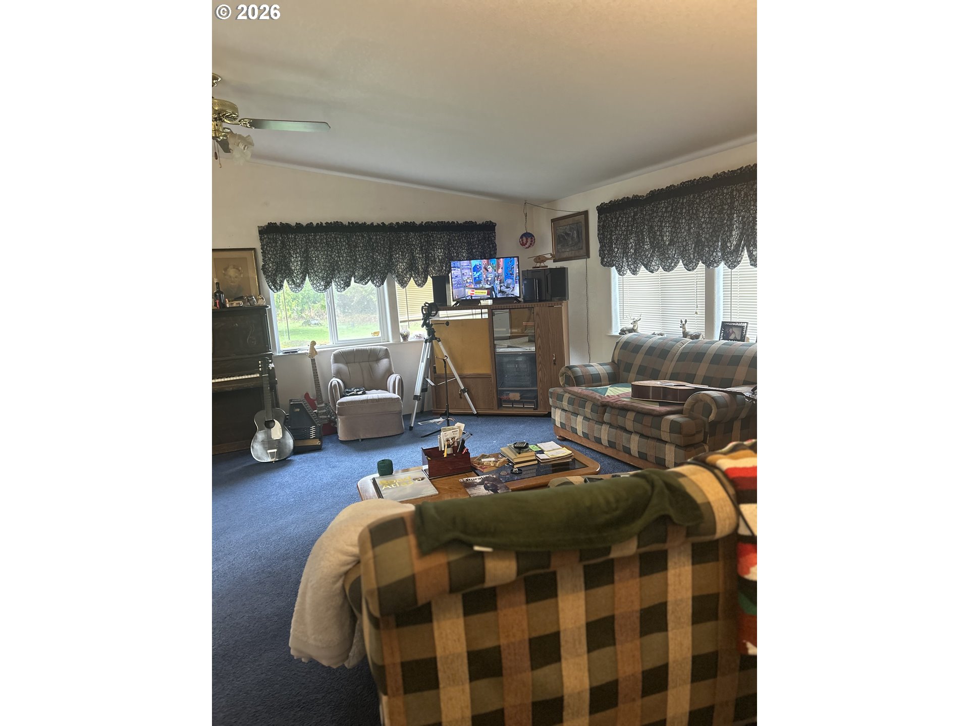 1105 Riverside Drive, Unit 17 Vernonia, OR 97064 - Photo 3 of 26 a living room with furniture and a flat screen tv