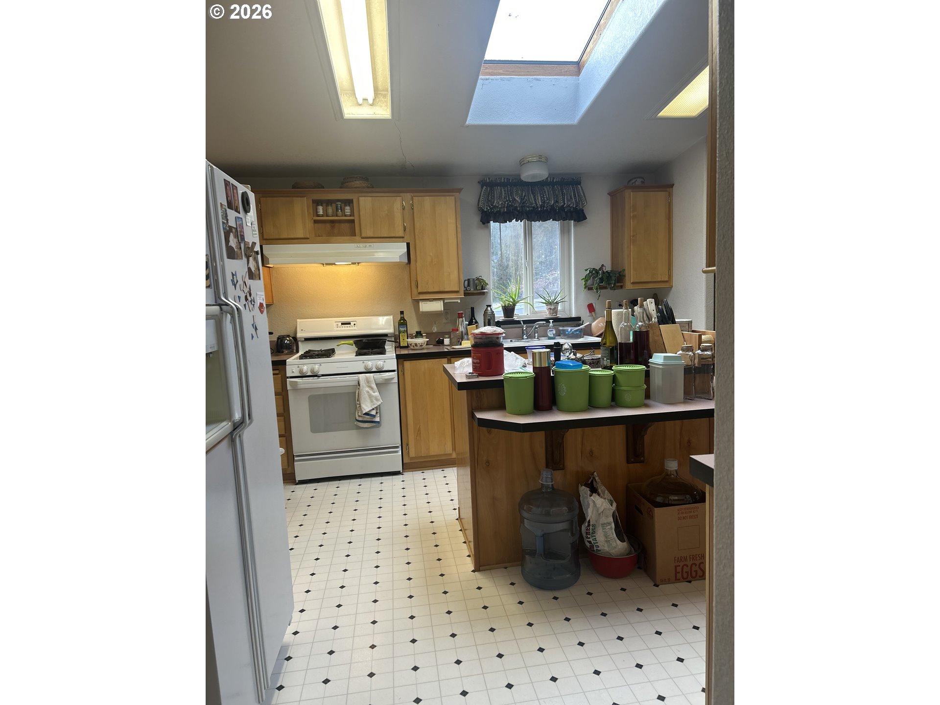 1105 Riverside Drive, Unit 17 Vernonia, OR 97064 - Photo 6 of 26 a kitchen with a sink a stove and cabinets