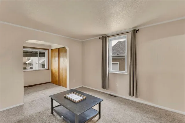a living room with furniture and windows