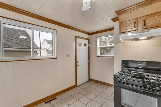 a kitchen with stainless steel appliances a stove and a refrigerator