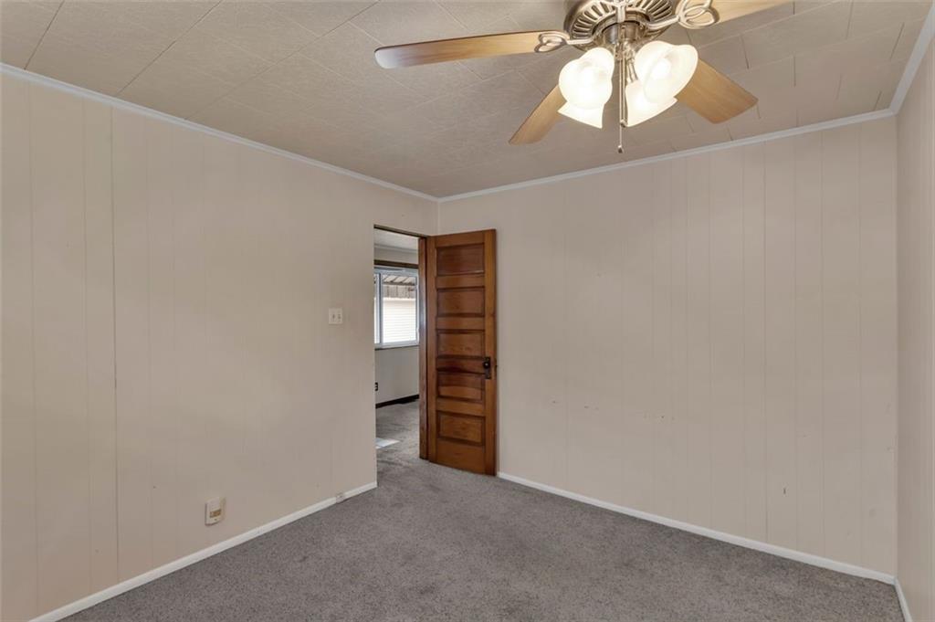 323 Sycamore Street Vandergrift, PA 15690 - Photo 15 of 28 an empty room with a fan and a window