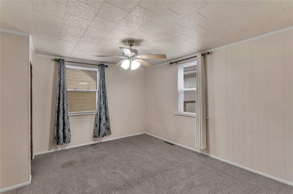323 Sycamore Street Vandergrift, PA 15690 - Photo 17 of 28 an empty room with chandelier fan