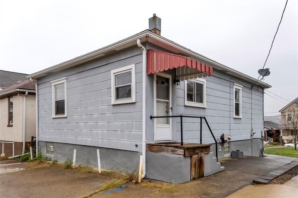 323 Sycamore Street Vandergrift, PA 15690 - Photo 21 of 28 a front view of a house with garage