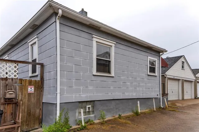 a front view of a house with parking space