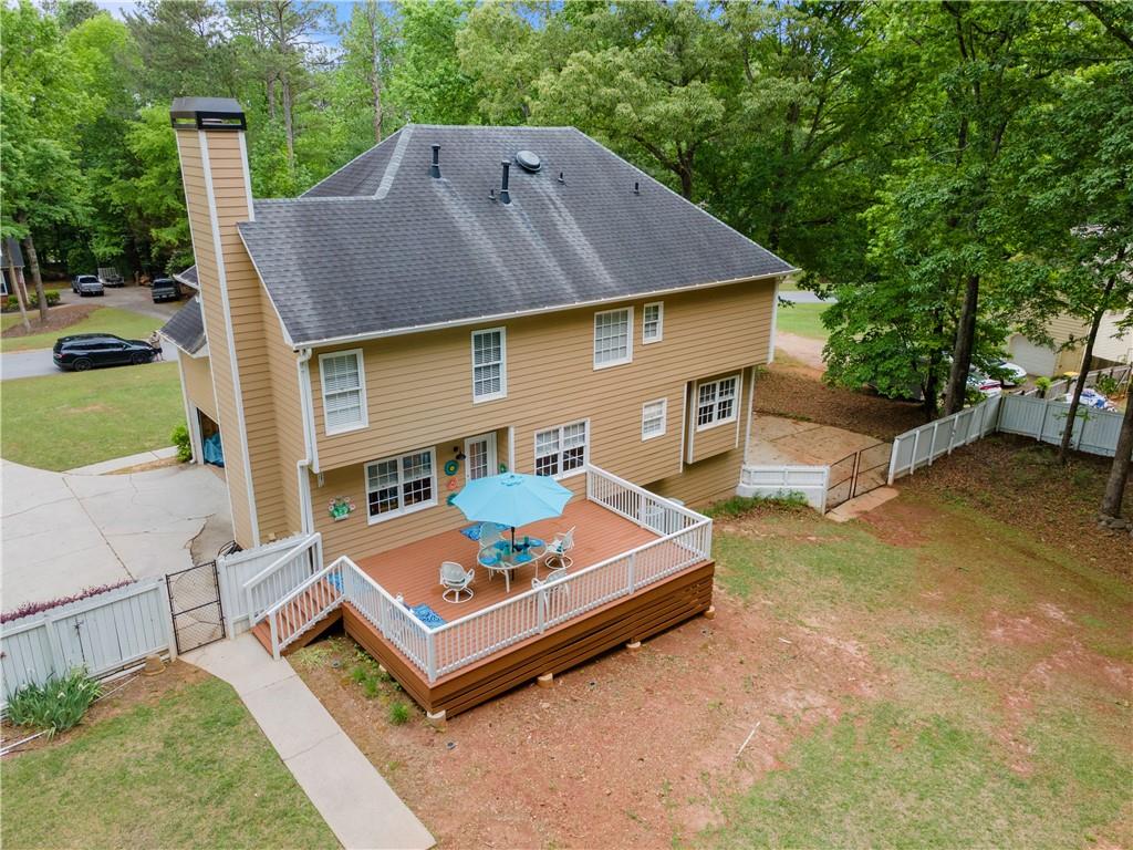 405 Ridgemont Drive Fayetteville, GA 30215 - Photo 42 of 43 a front view of a house with a yard table and chairs