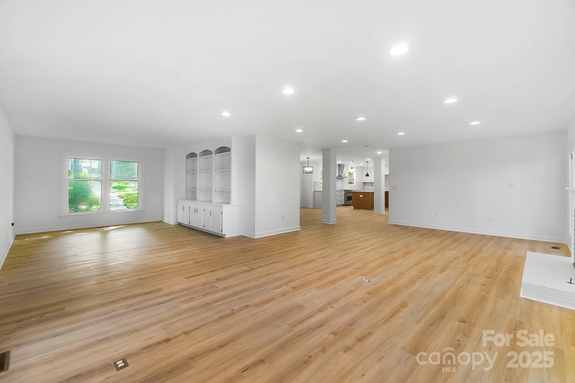3323 Lincoln Lane Gastonia, NC 28056 - Photo 12 of 47 a view of empty room with wooden floor and windows