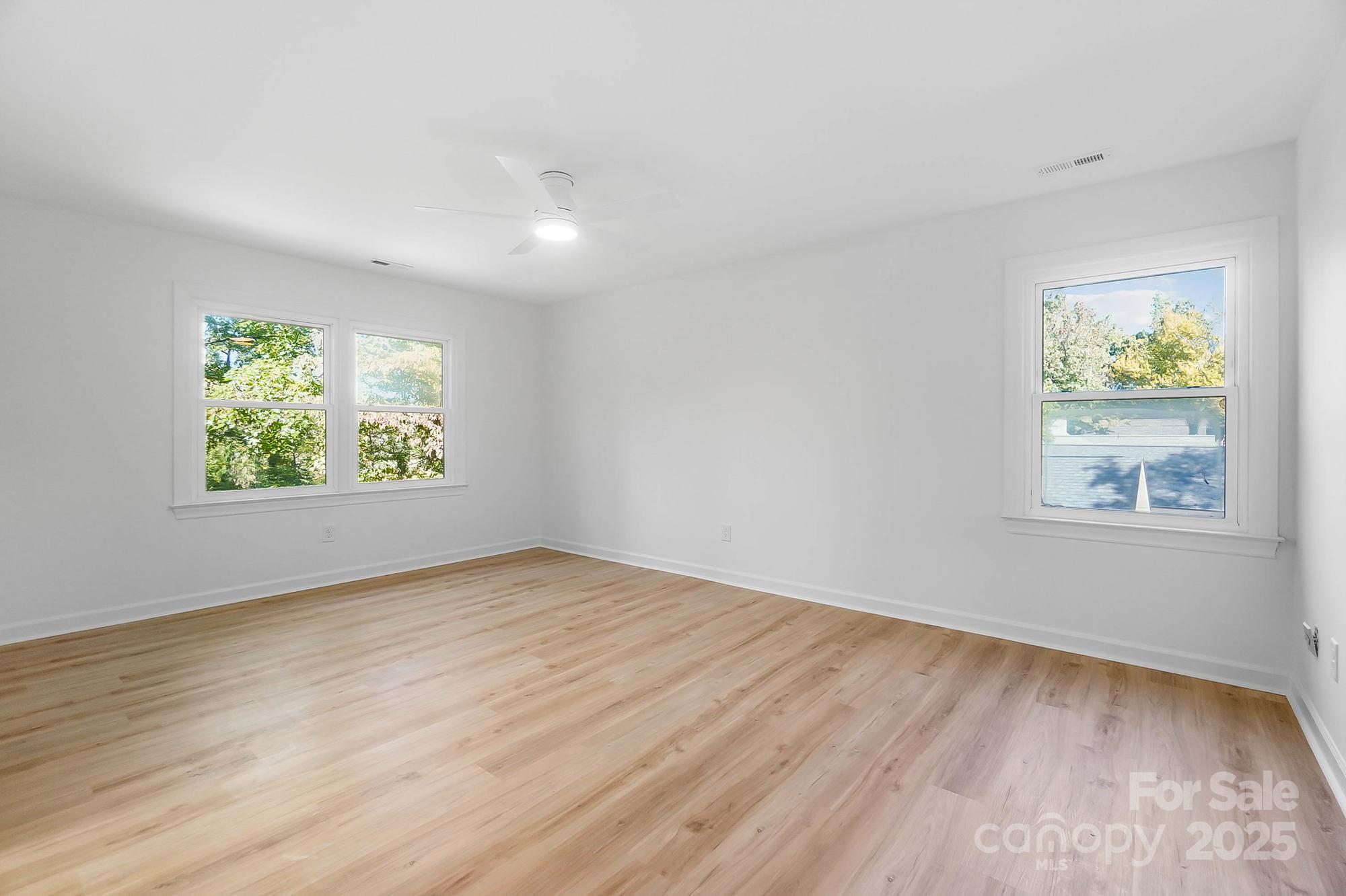 3323 Lincoln Lane Gastonia, NC 28056 - Photo 23 of 47 wooden floor in an empty room with a window
