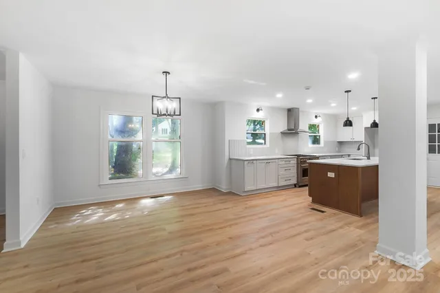 a view of kitchen with wooden floor and window