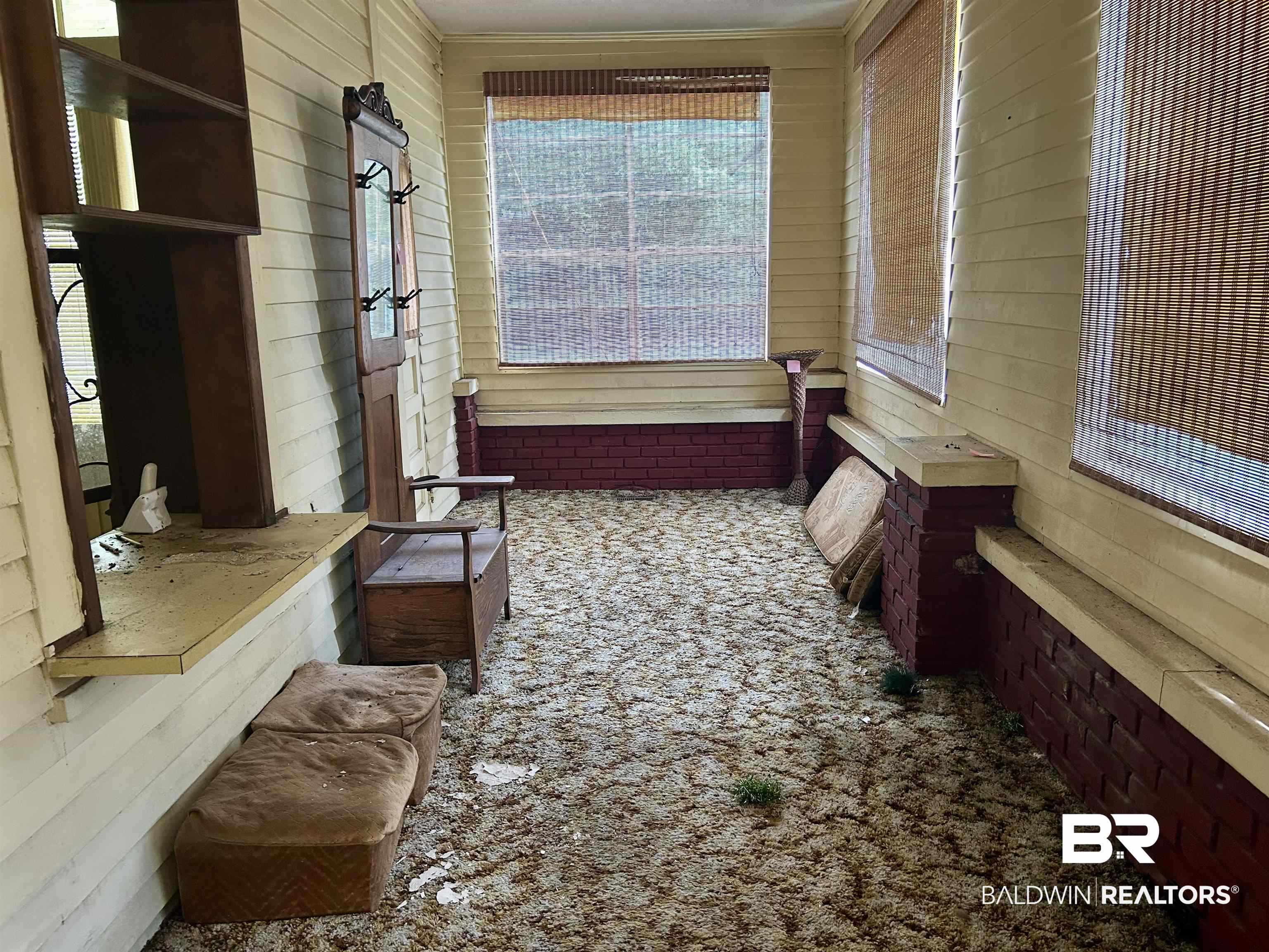 302 Stocking Street Mobile, AL 36604 - Photo 15 of 31 Enclosed porch with panel siding and partial brick walls