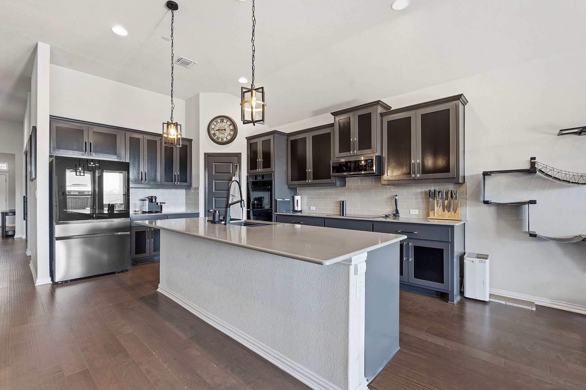 12616 Twisted Root Drive Manchaca, TX 78652 - Photo 3 of 36 The sleek and stylish gourmet island kitchen comes upgraded with the whole contemporary package.