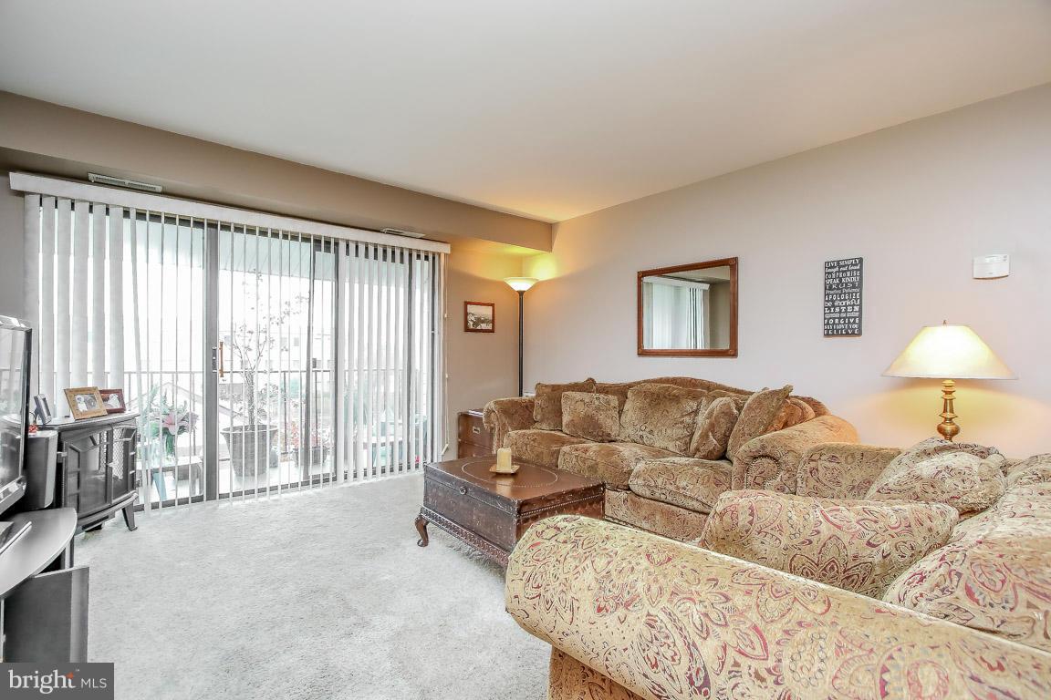 2572 Riva Road, Unit 16B Annapolis, MD 21401 - Photo 5 of 22 a living room with furniture and a large window