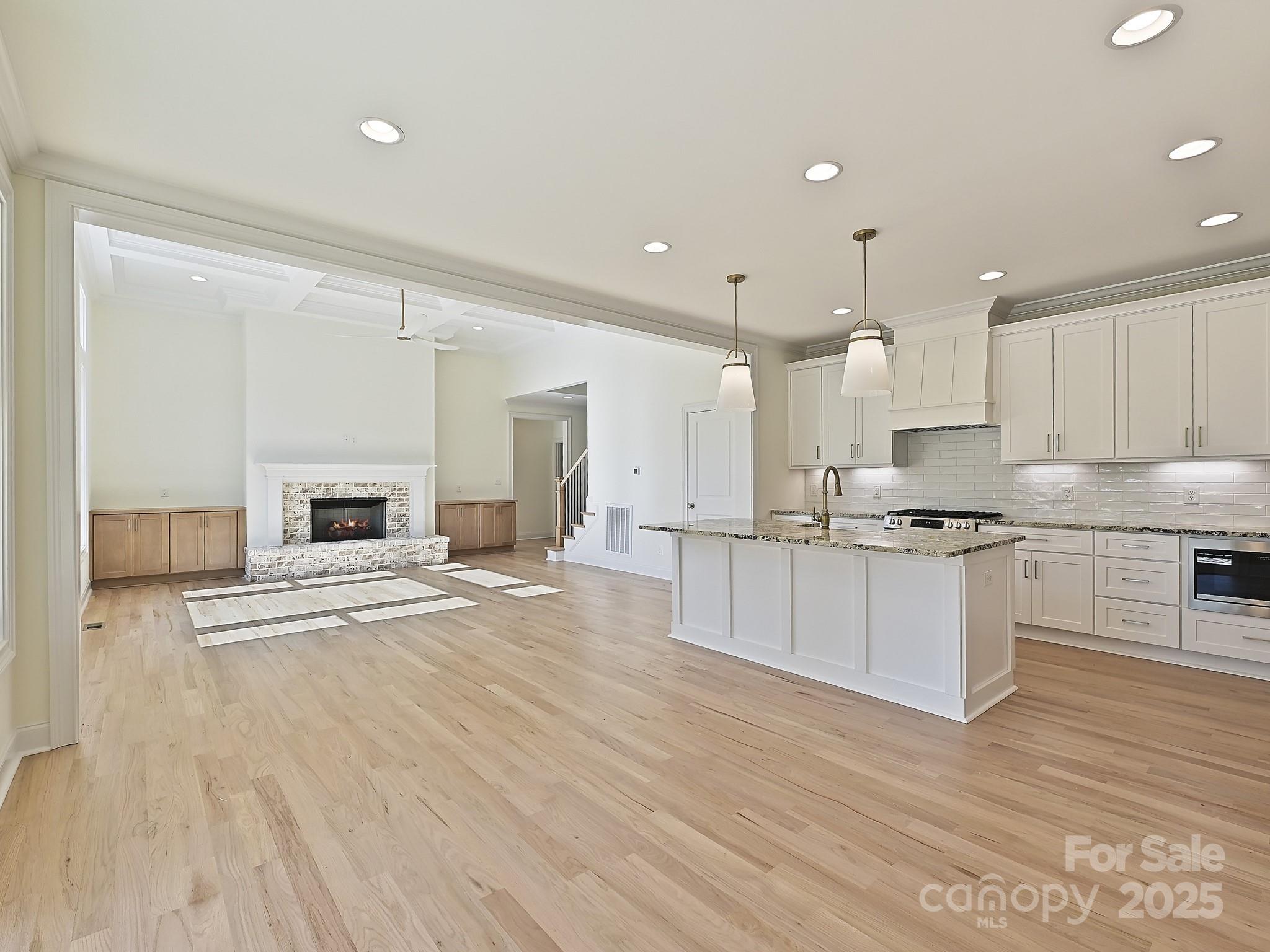 215 Triple Ponds Court Clover, SC 29710 - Photo 15 of 32 a large kitchen with kitchen island a sink stainless steel appliances and cabinets