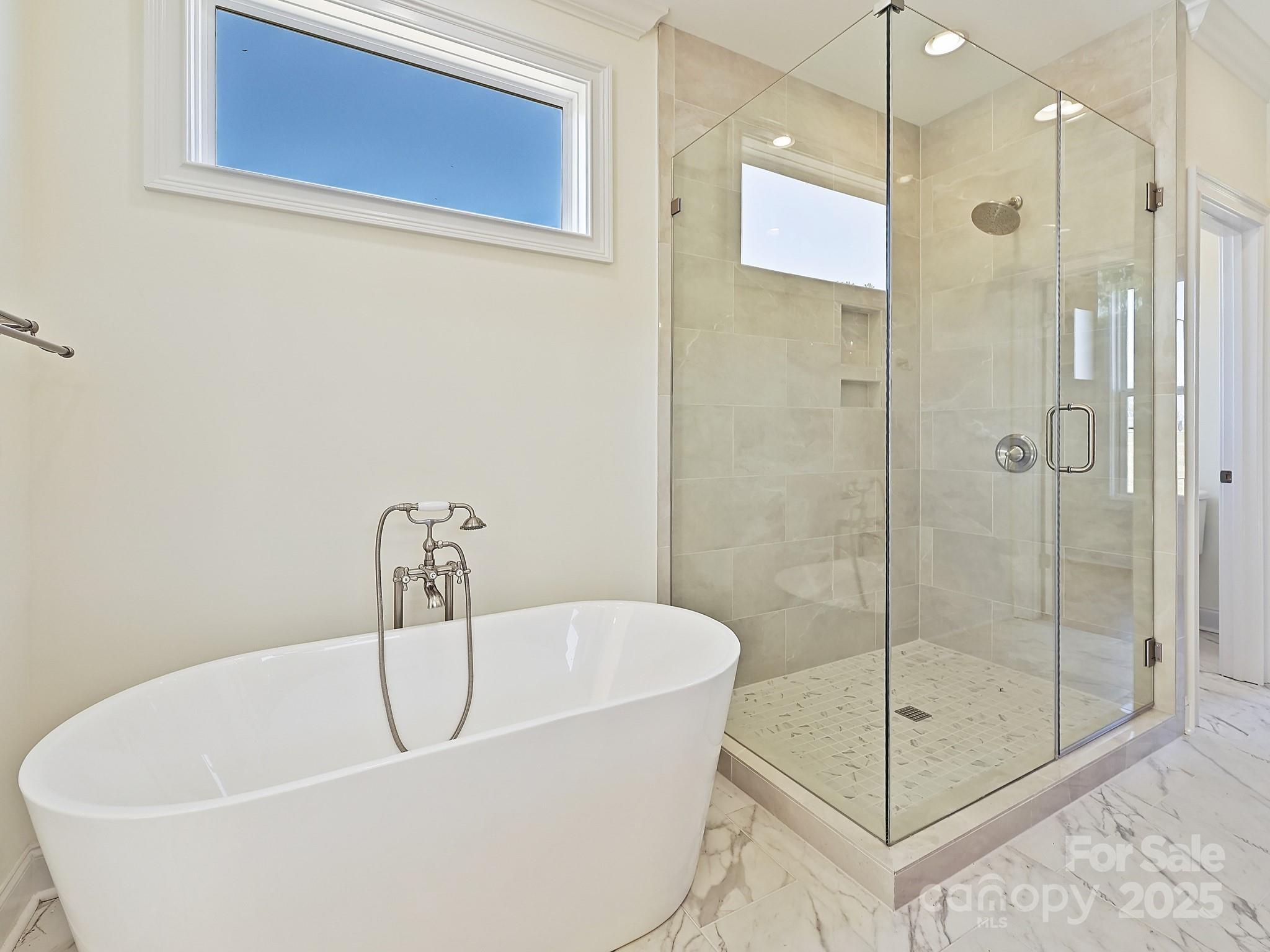 215 Triple Ponds Court Clover, SC 29710 - Photo 21 of 32 a white bath tub sitting next to a shower