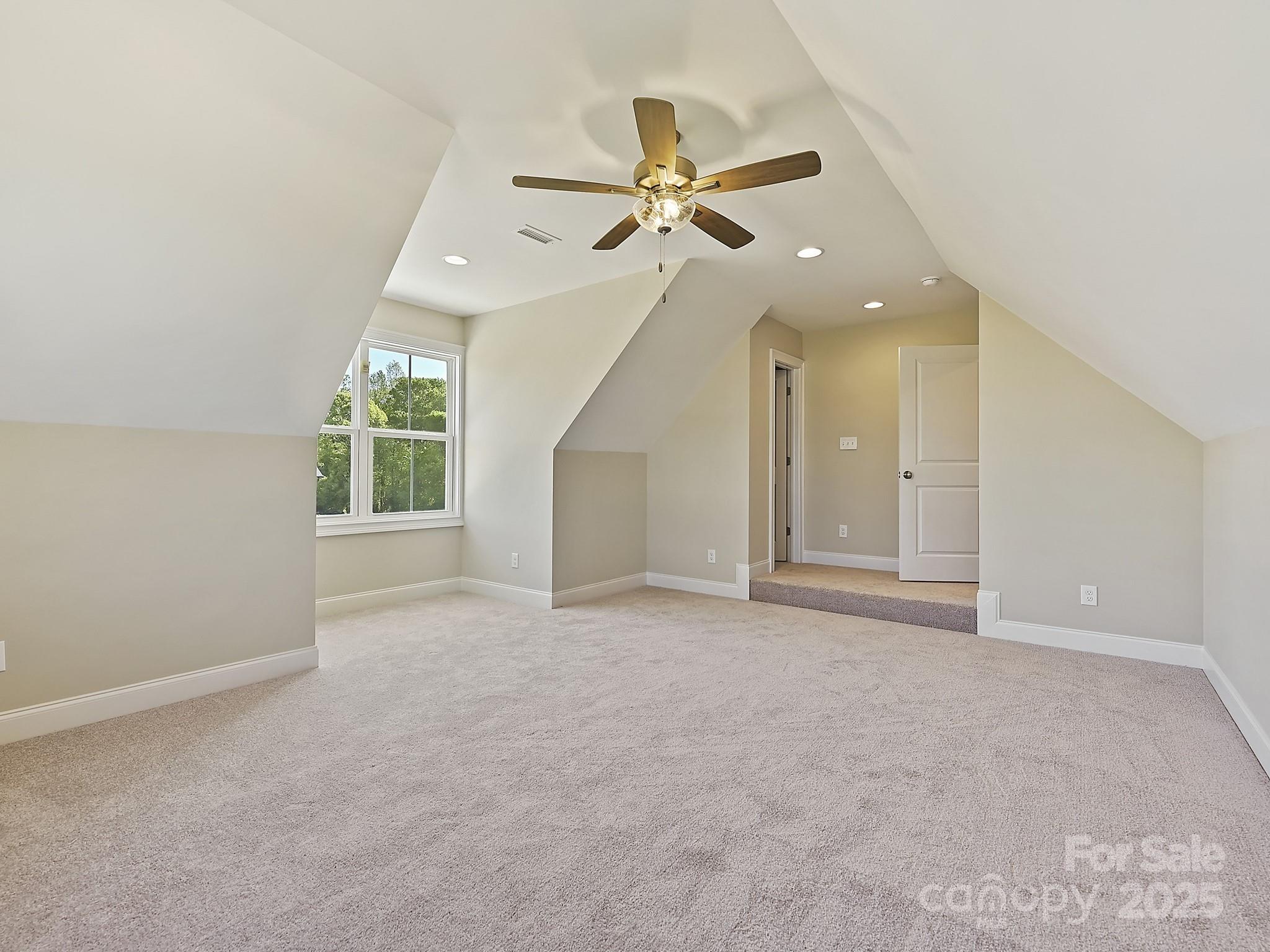 215 Triple Ponds Court Clover, SC 29710 - Photo 30 of 32 an empty room with windows and fan