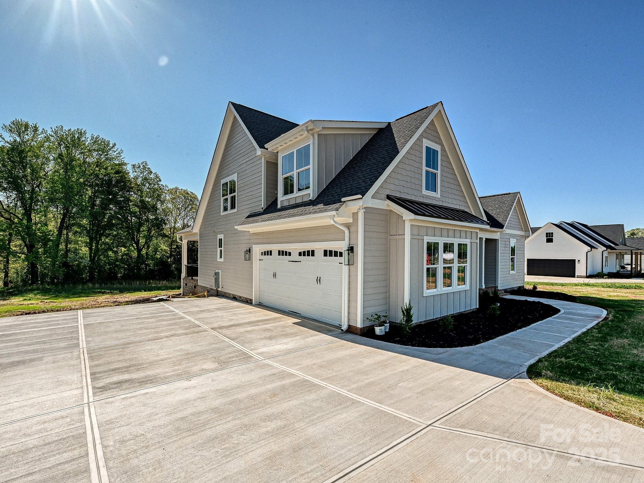215 Triple Ponds Court Clover, SC 29710 - Photo 32 of 32 a front view of a house with a yard and garage