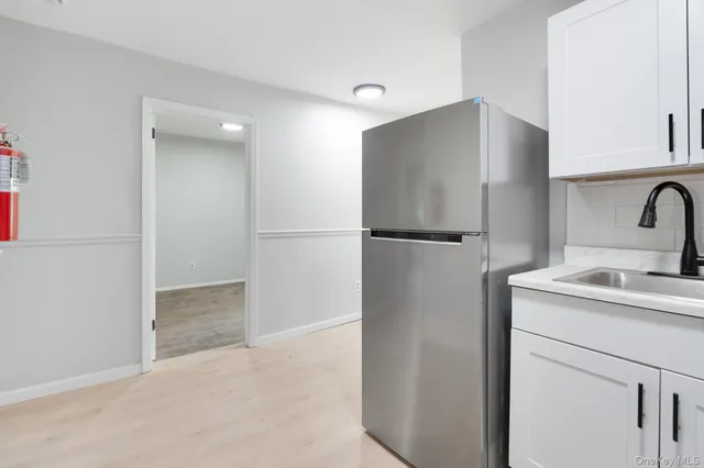 a bathroom with a toilet a sink and a mirror