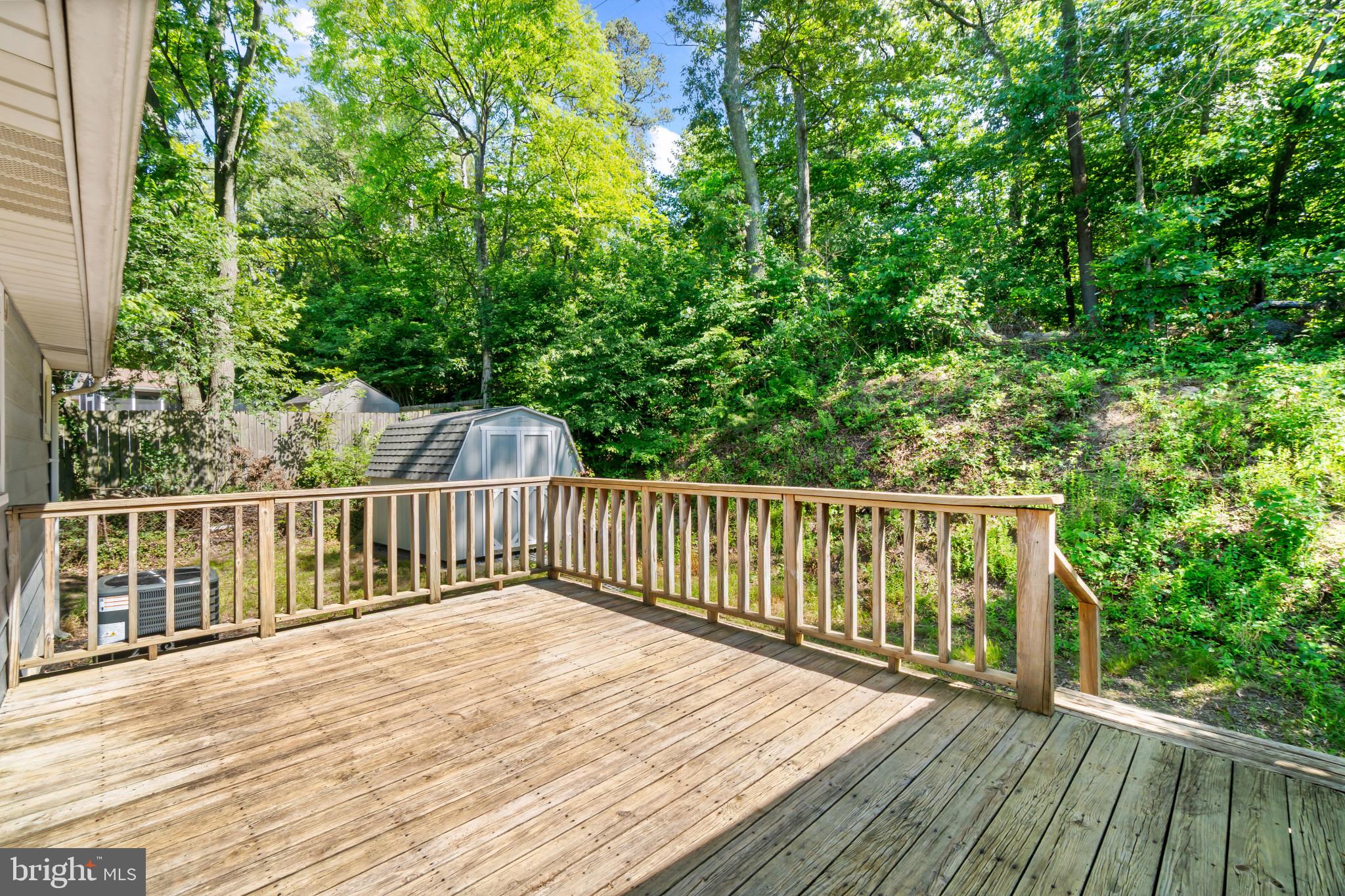 415 Baylor Road Glen Burnie, MD 21061 - Photo 22 of 29 a balcony with wooden floor and trees