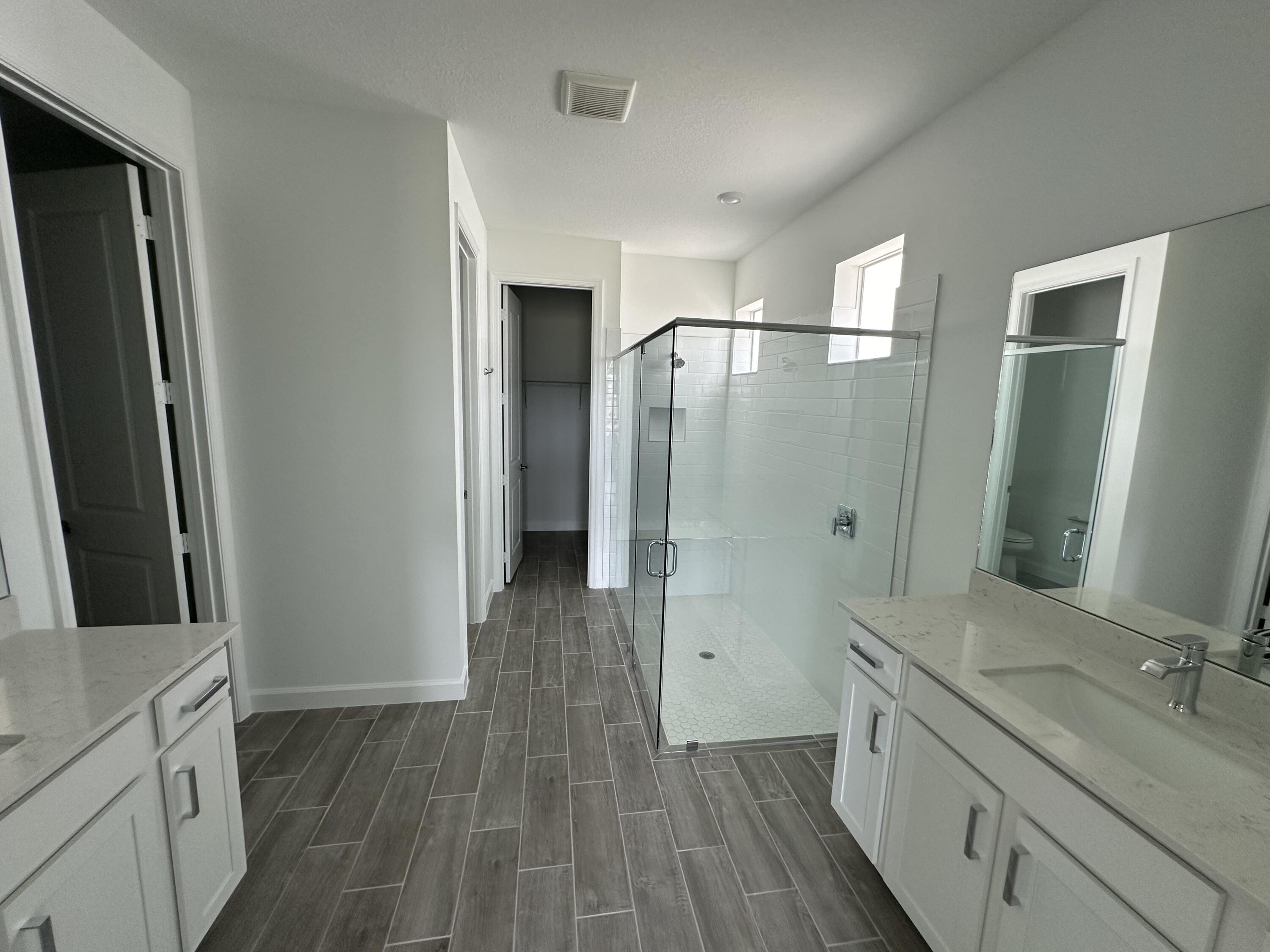 19046 Croft Mill Crossing Loxahatchee, FL 33470 - Photo 11 of 22 a bathroom with a sink and a mirror