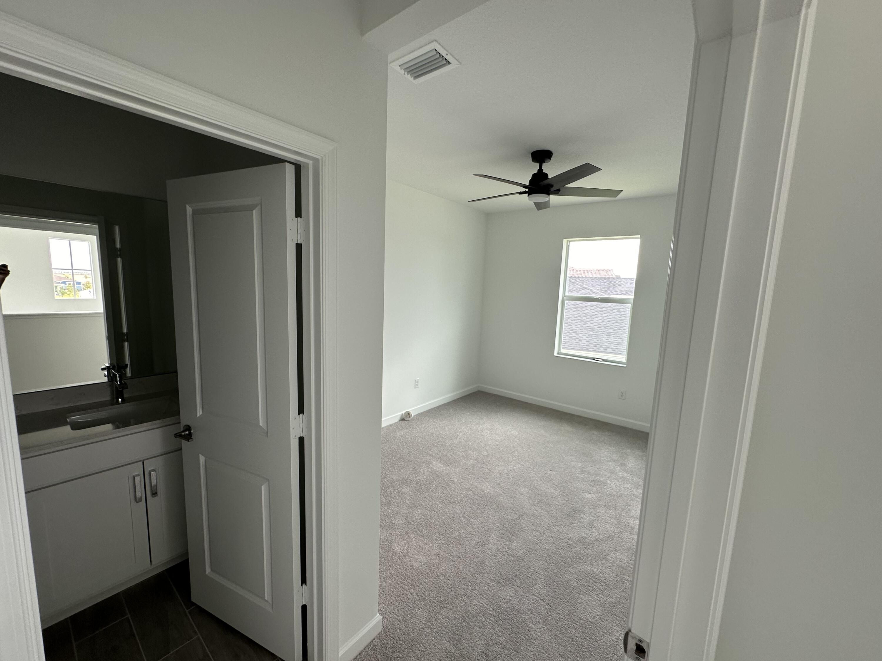 19046 Croft Mill Crossing Loxahatchee, FL 33470 - Photo 14 of 22 a view of a kitchen with a sink and a window