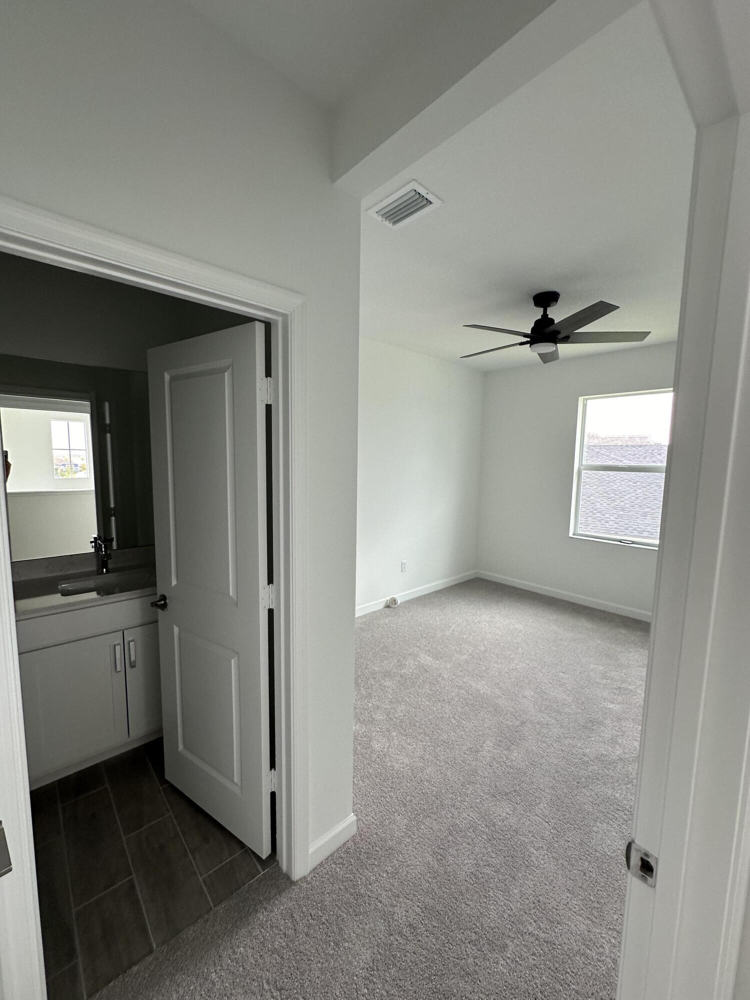 19046 Croft Mill Crossing Loxahatchee, FL 33470 - Photo 15 of 22 an empty room with a empty space and windows