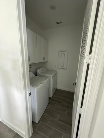 a utility room with a sink dryer and washer