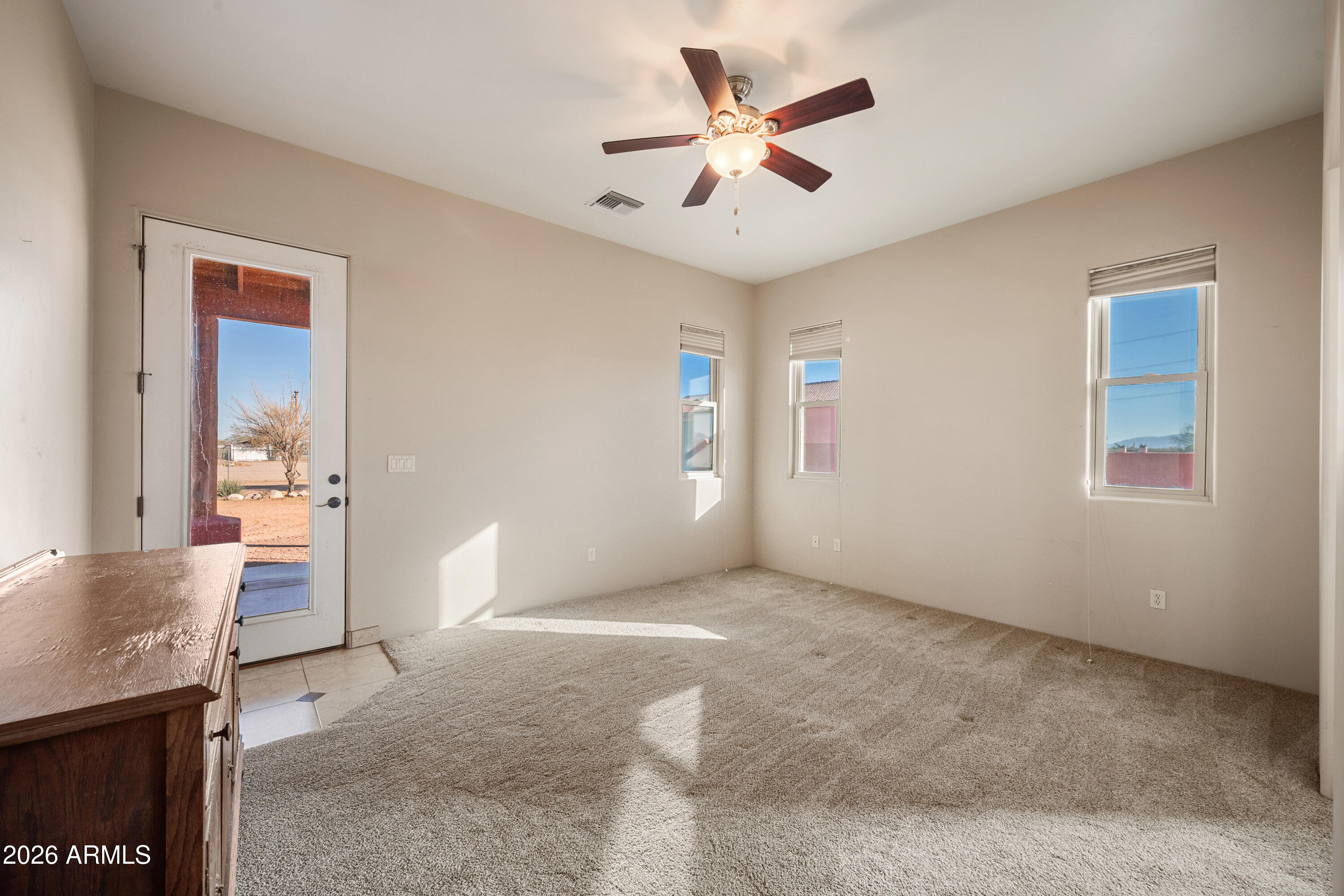 8679 North Warren Road Maricopa, AZ 85139 - Photo 11 of 40 a view of an empty room with a window