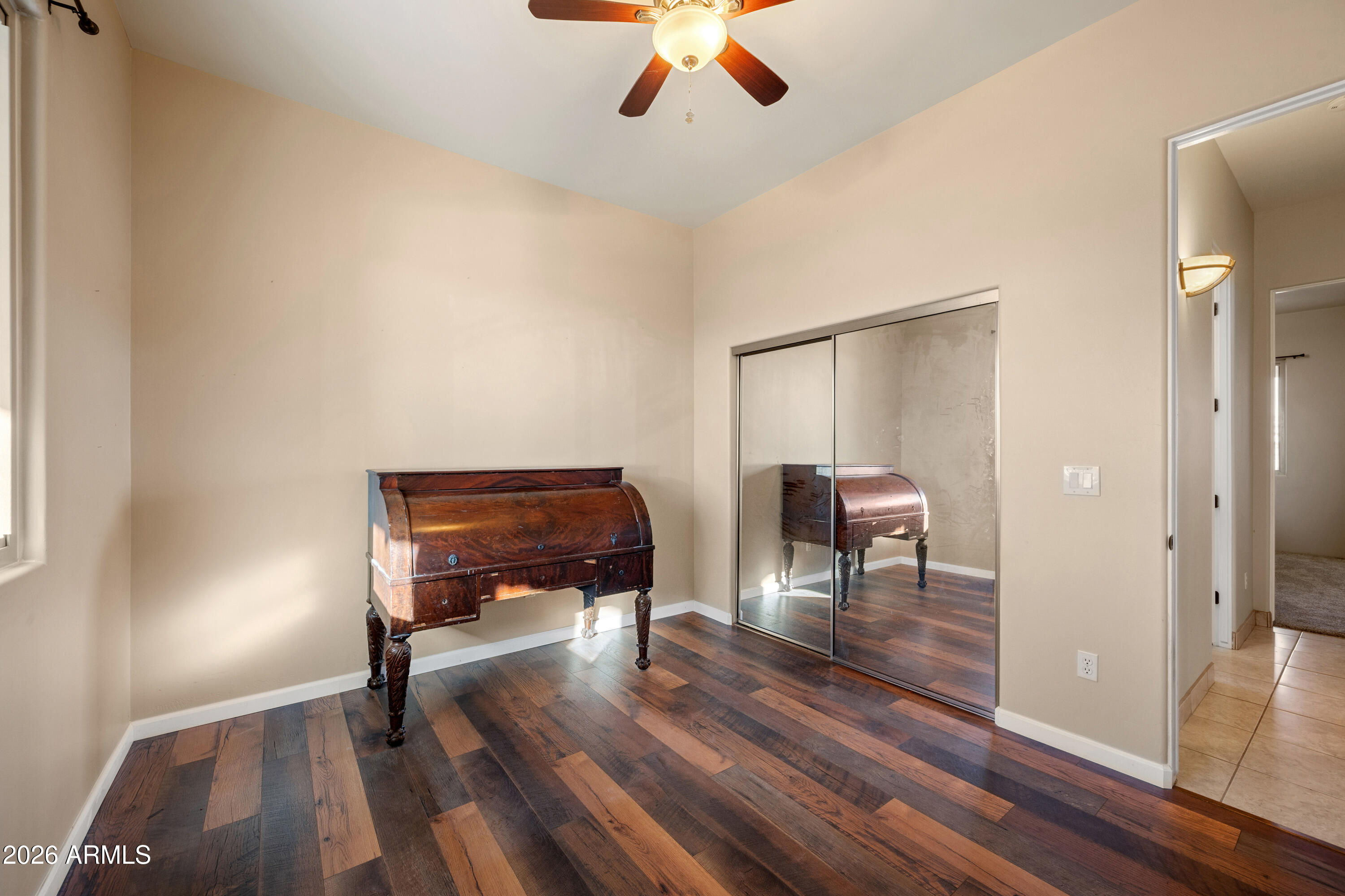 8679 North Warren Road Maricopa, AZ 85139 - Photo 18 of 40 a living room with furniture and a wooden floor