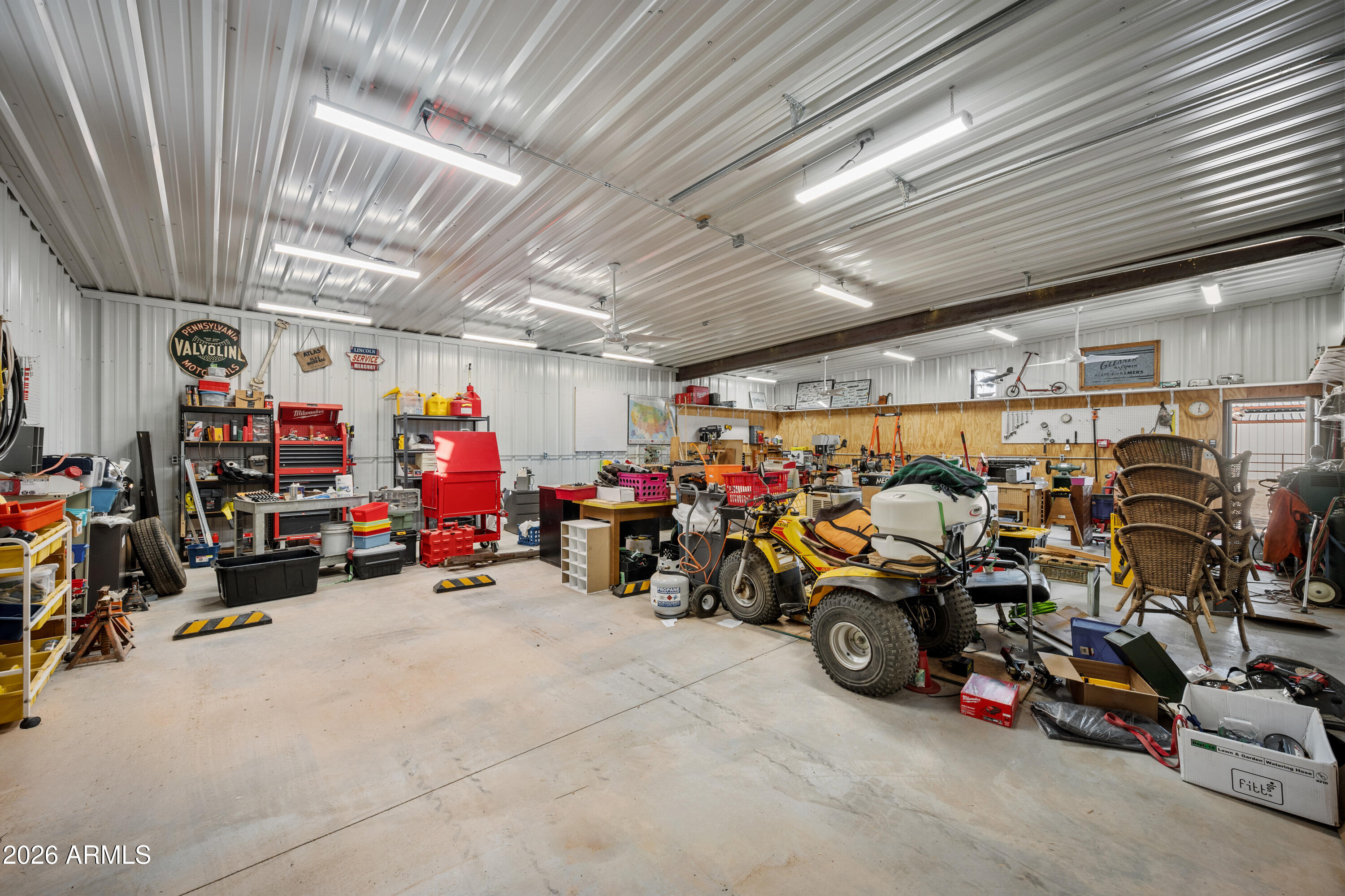 8679 North Warren Road Maricopa, AZ 85139 - Photo 25 of 40 a view of a storage room with a table and chairs