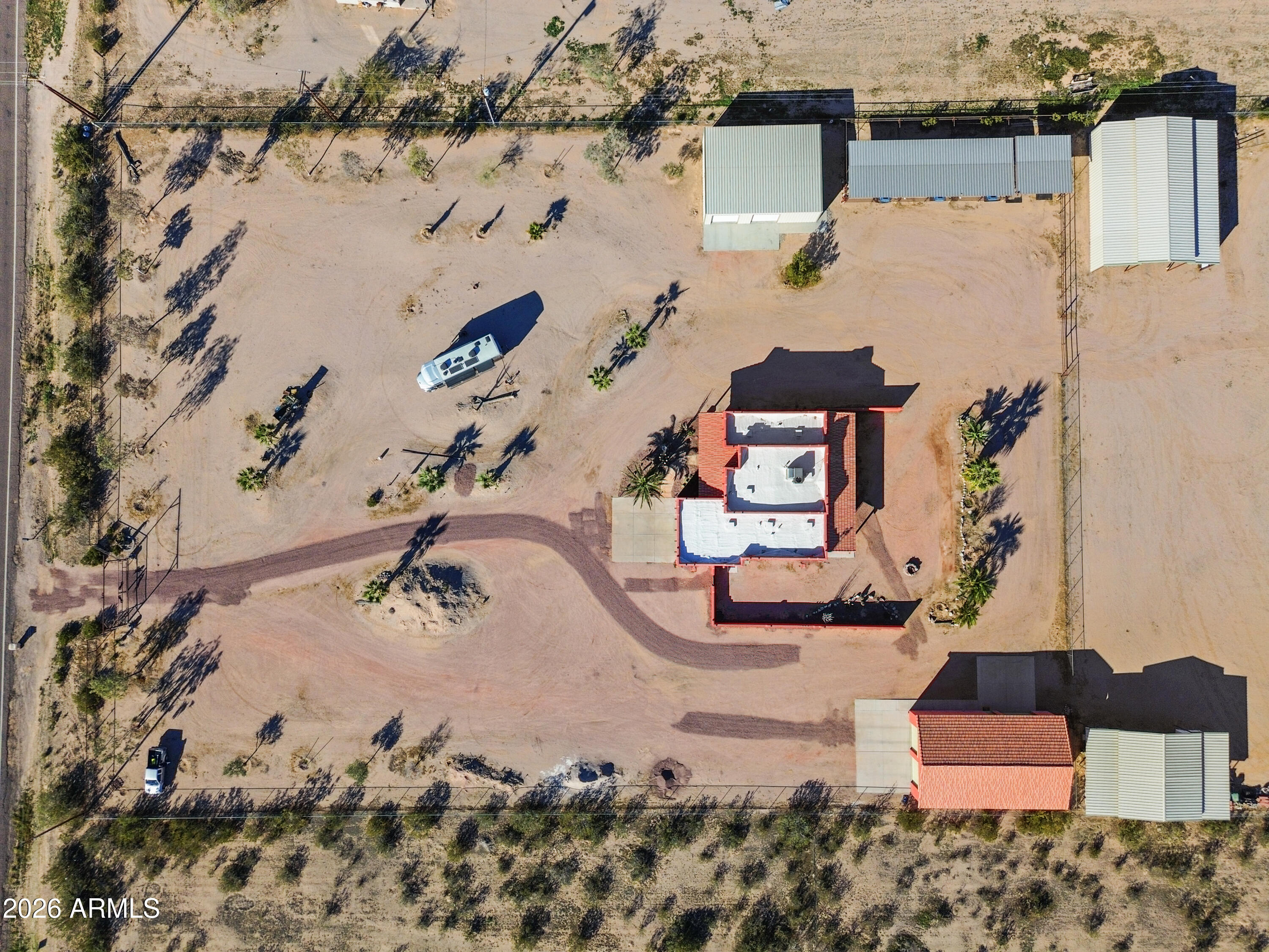 8679 North Warren Road Maricopa, AZ 85139 - Photo 35 of 40 an aerial view of a house with a yard