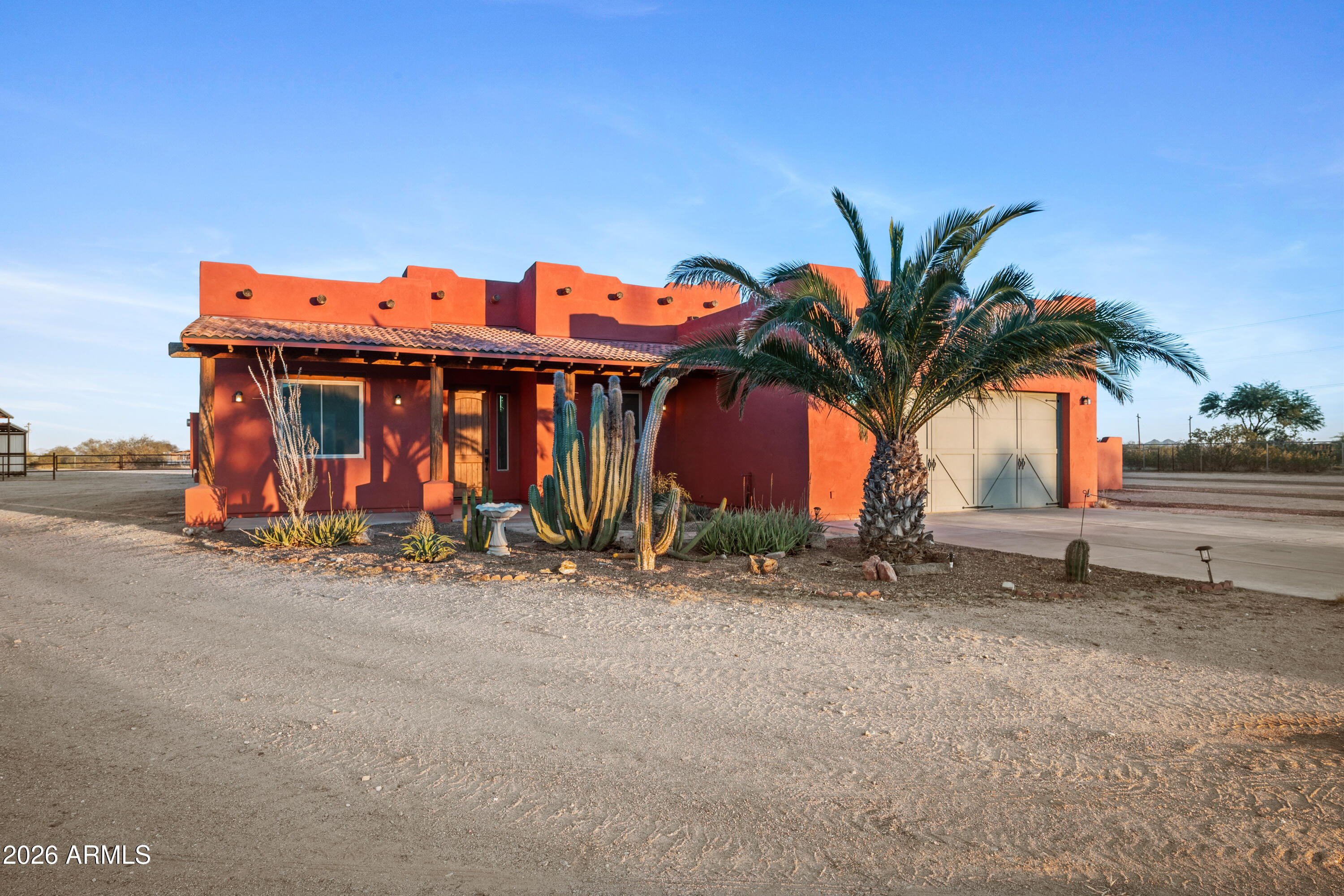 8679 North Warren Road Maricopa, AZ 85139 - Photo 3 of 40 a front view of a house with porch and furniture