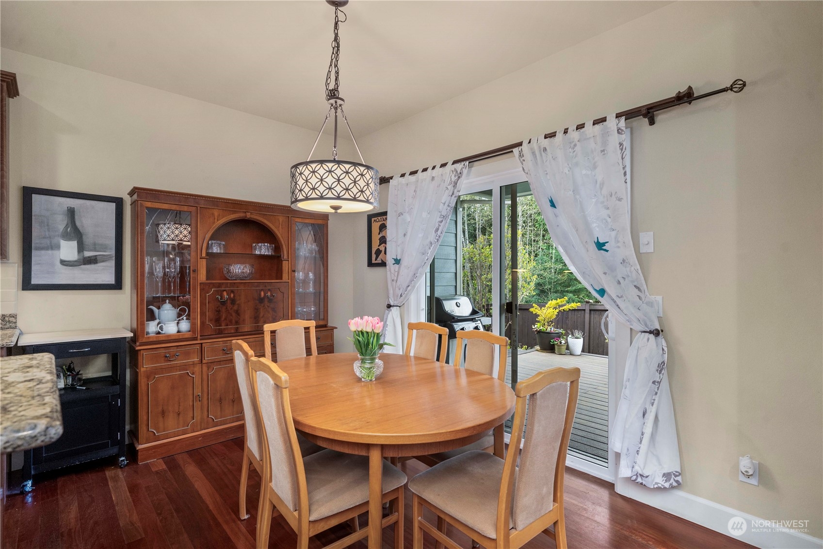 6765 Southeast 2nd Street Renton, WA 98059 - Photo 14 of 36 a view of a dining room with furniture window and wooden floor