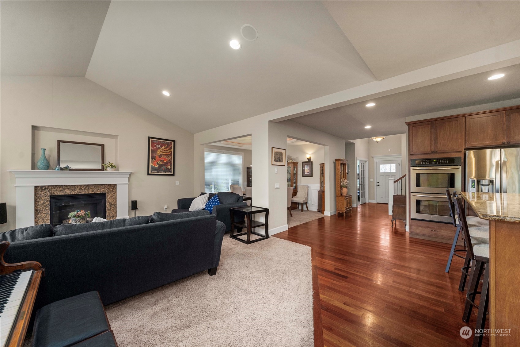 6765 Southeast 2nd Street Renton, WA 98059 - Photo 15 of 36 a living room with furniture and a fireplace