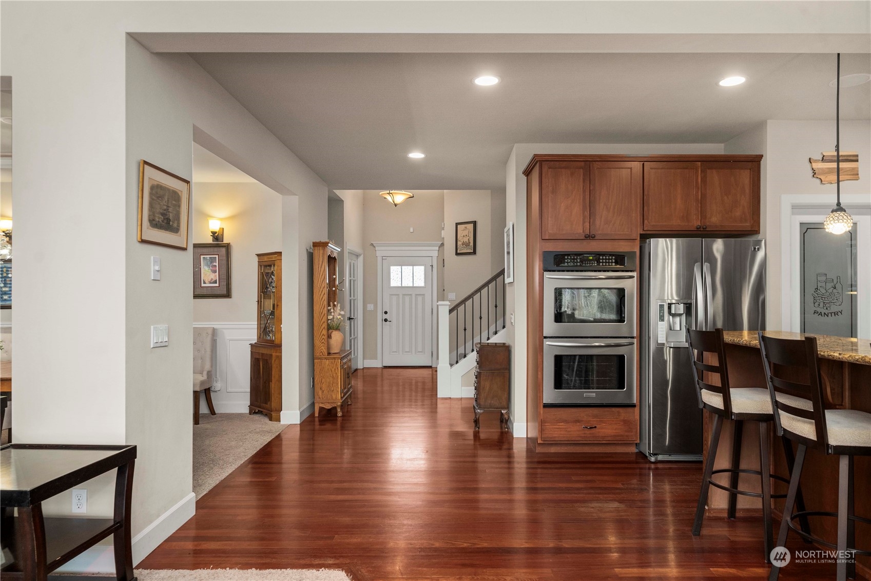 6765 Southeast 2nd Street Renton, WA 98059 - Photo 16 of 36 a view of a kitchen with refrigerator and wooden floor