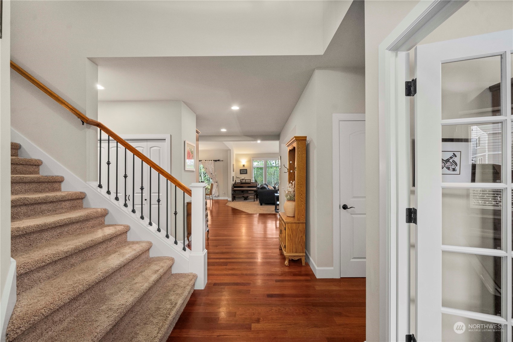 6765 Southeast 2nd Street Renton, WA 98059 - Photo 2 of 36 a view of a hallway view with wooden floor and staircase