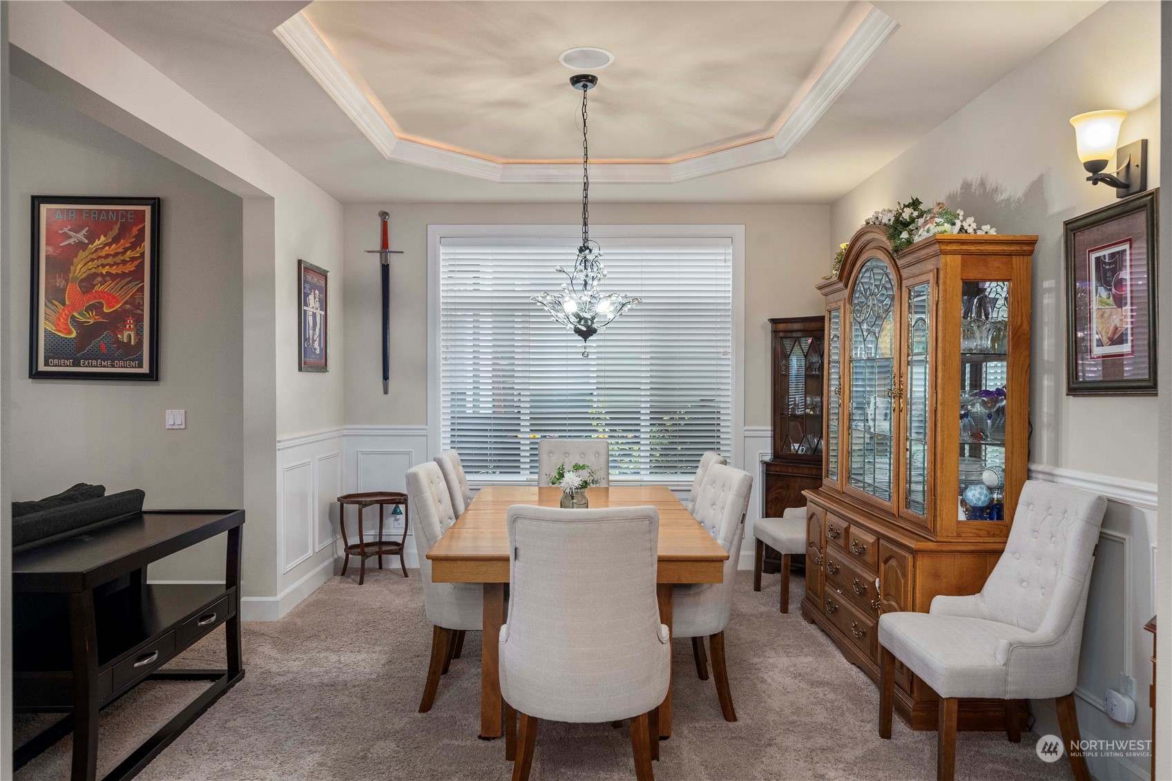 6765 Southeast 2nd Street Renton, WA 98059 - Photo 3 of 36 a dining room with furniture a chandelier and window