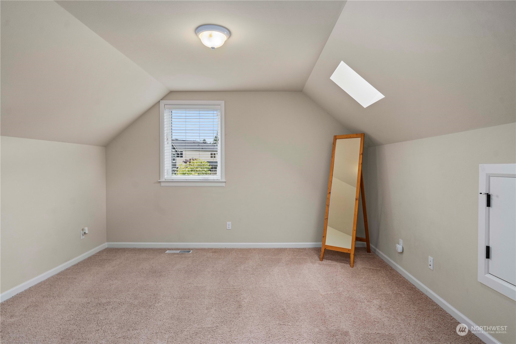 6765 Southeast 2nd Street Renton, WA 98059 - Photo 31 of 36 an empty room with a window and a ceiling fan