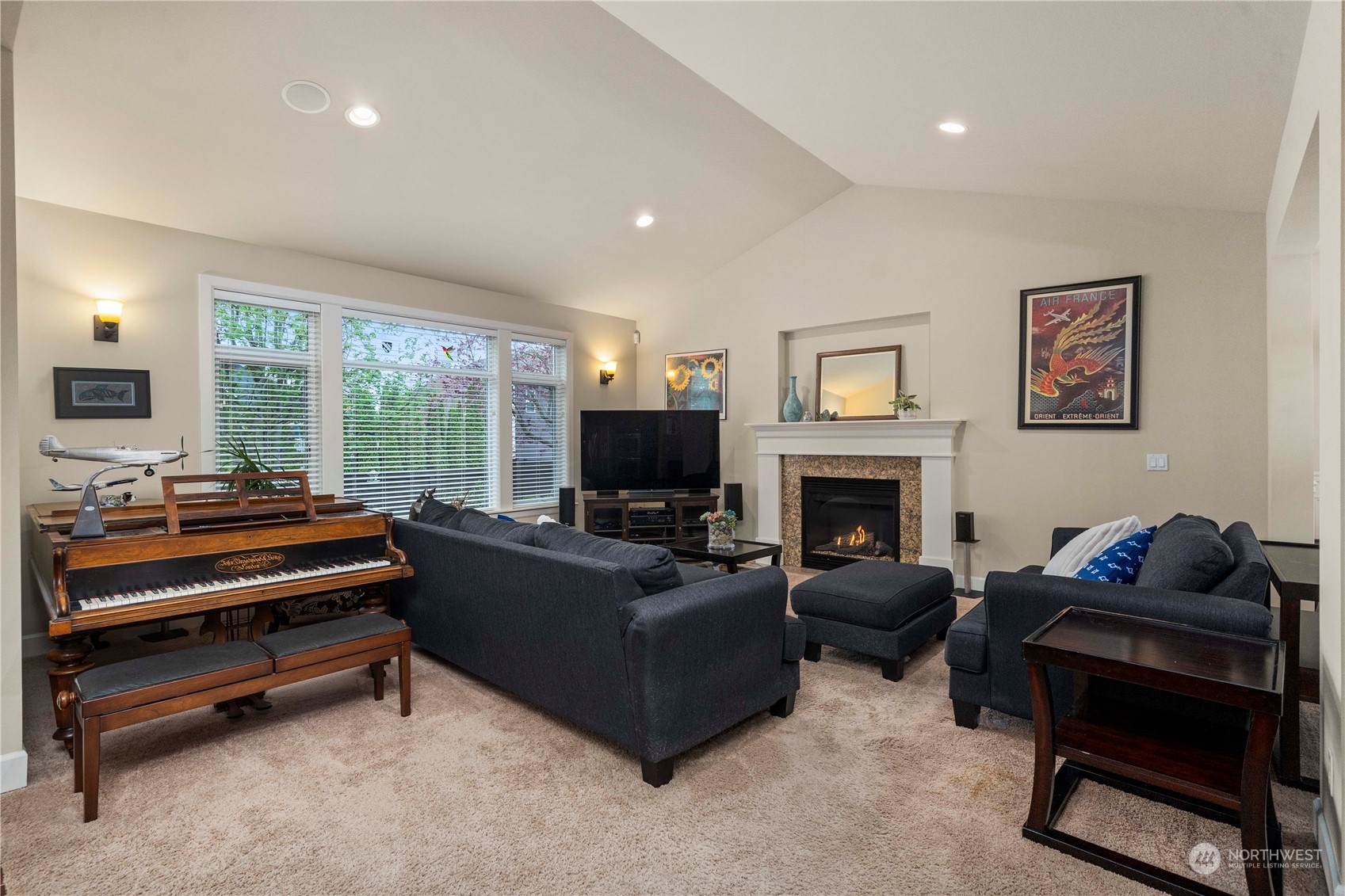 6765 Southeast 2nd Street Renton, WA 98059 - Photo 5 of 36 a living room with furniture a flat screen tv and a fireplace