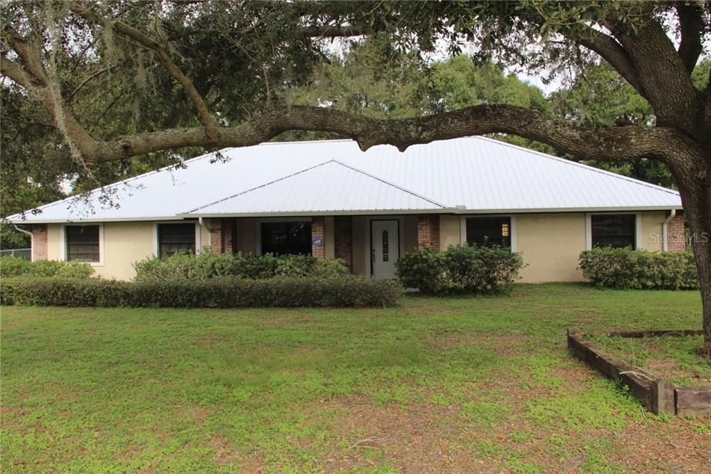 3520 Medulla Road Plant City, FL 33566 - Photo 1 of 1 Front View of the Home and Yard.