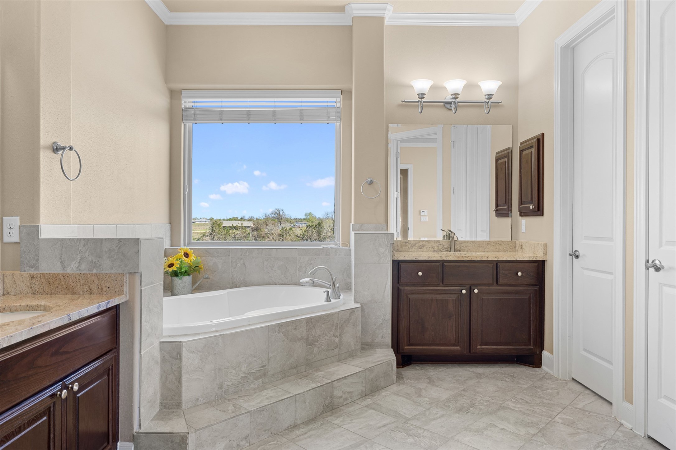 1813 Cemetery Road Bellville, TX 77418 - Photo 13 of 26 a bathroom with a tub sink and mirror
