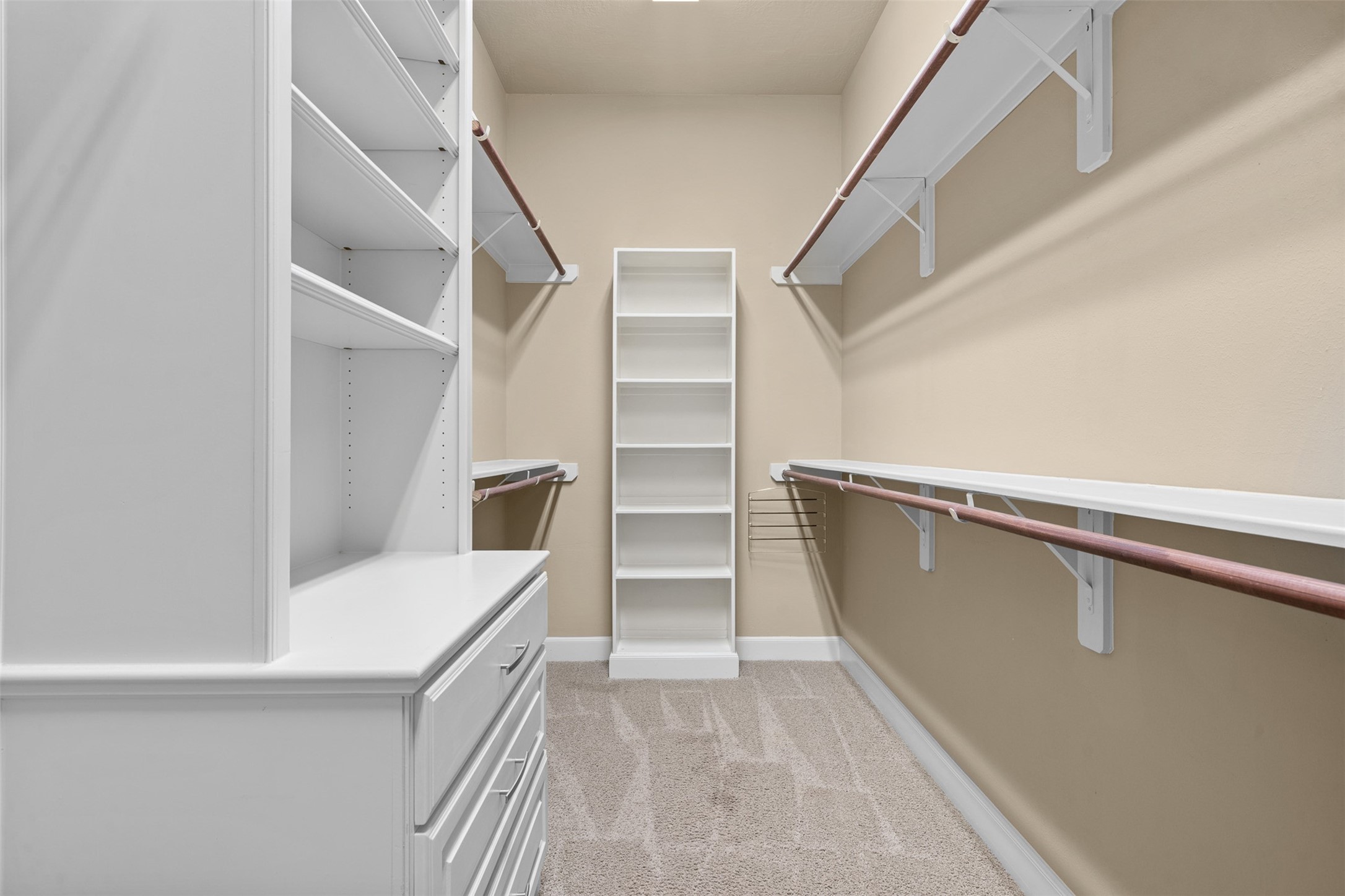 1813 Cemetery Road Bellville, TX 77418 - Photo 16 of 27 a view of walk in closet with empty racks