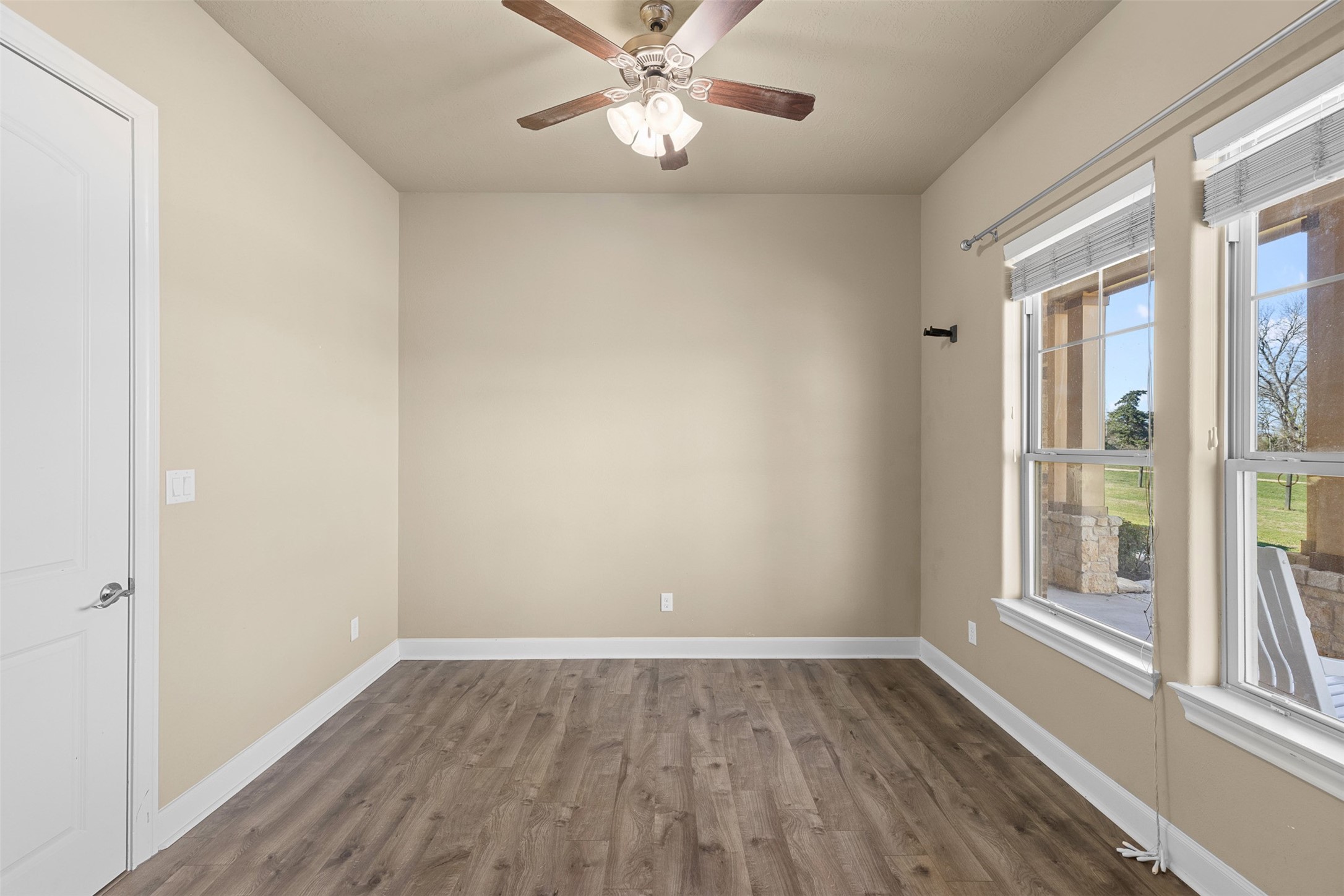 1813 Cemetery Road Bellville, TX 77418 - Photo 18 of 26 a view of an empty room with wooden floor and a window