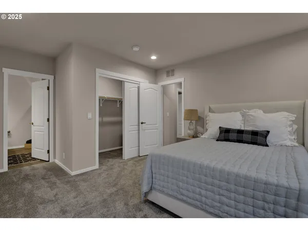 a bedroom with a bed and a view