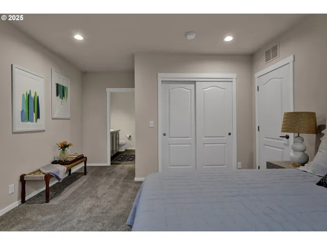 a living room with furniture and a dresser