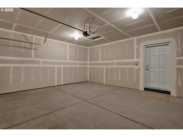 a view of a garage with white walls