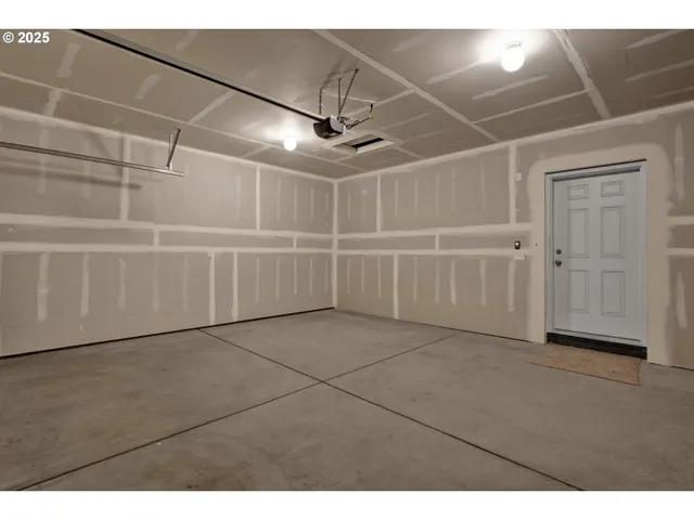 a view of a garage with white walls