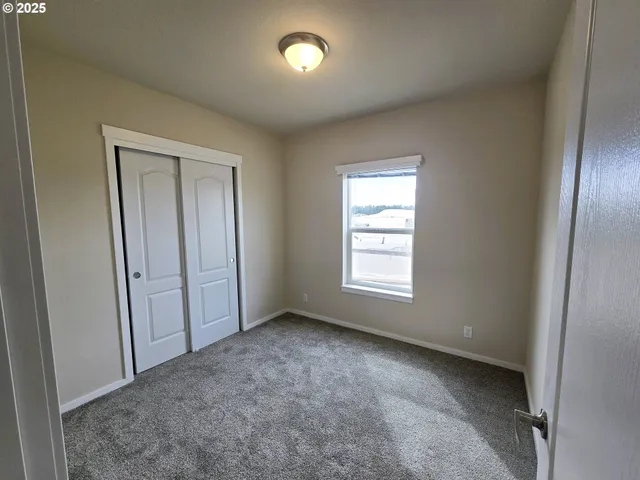 an empty room with a empty space and windows